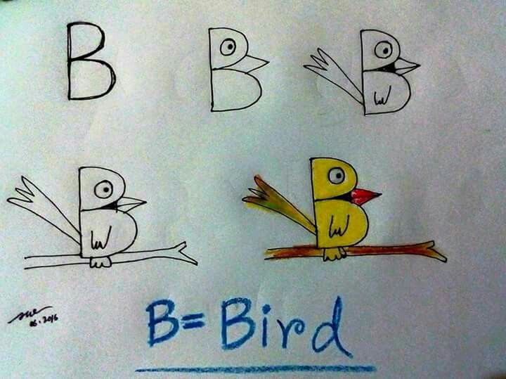 a drawing of birds and letters on a white board