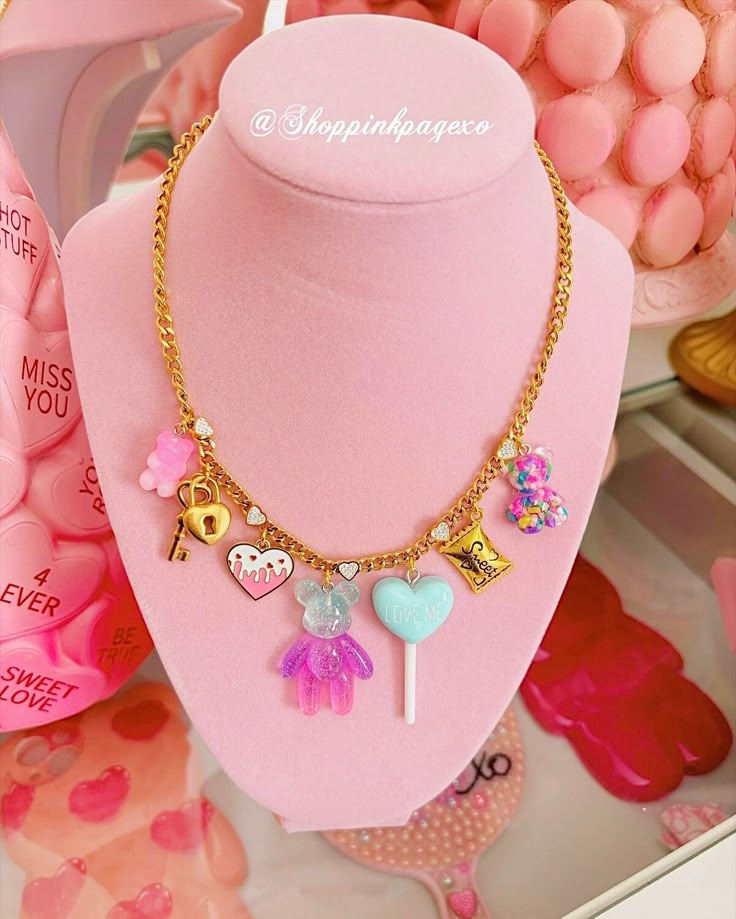 "Key to my heart gold charms handmade necklace, includes 7 charms that you will absolutely love. Pink gummy bear, lock & key, pink heart, big glitter bear, love me lollipop, sweets, multi color teddy bear charms, they are all so girly and stunning. This necklace is so adorable for Valentine's Day & would also be a great gift for the ones you love.  Measurements.  17.7\" Follow my shop to be notified of new releases & exclusive discounts.  Have a blessed day." Valentines Day Jewelry, Charm Necklace Ideas, Preppy Necklaces, Date Night Fashion, Polymer Earrings, Kawaii Accessories, Diy Bracelet Designs, Key To My Heart, Funky Jewelry