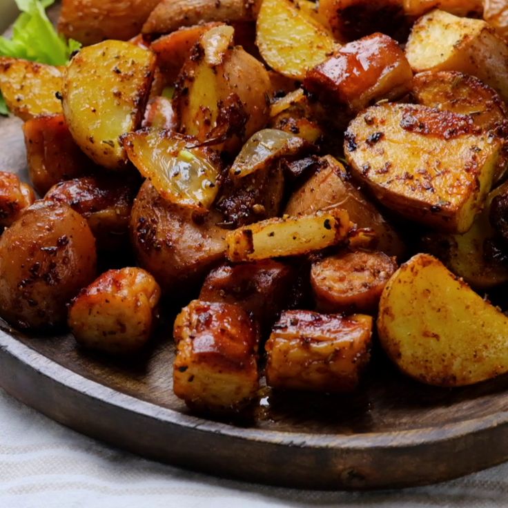 a plate full of cooked potatoes and lettuce