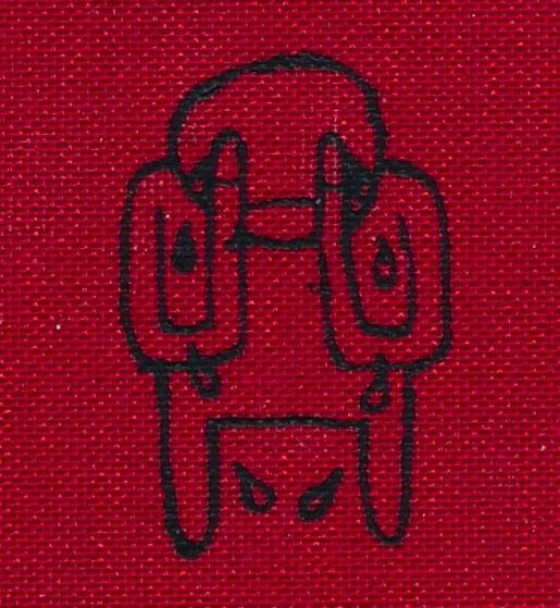 a red cloth with a drawing of a man's face on it