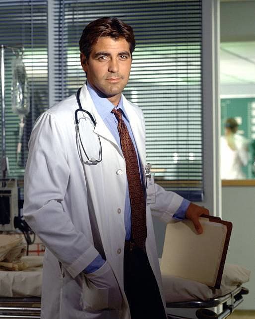 a man in a white lab coat and tie holding a suitcase with stethoscopes on it