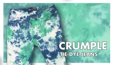 a pair of blue and green tie - dye jeans with the words crumple on it