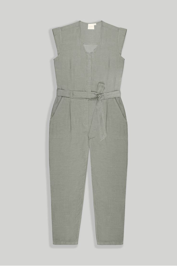 Our Evening Chai Hemp V-Neck Jumpsuit - a chic V-neck ensemble designed for stylish versatility. Featuring micro sleeves and straight-cut legs, this trendy jumpsuit offers a voguish look, perfect from day to night. Crafted with a tapered fit and a concealed placket, this jumpsuit has functional pockets on both sides, adding practicality to its stylish appeal. Elevate your wardrobe with this contemporary piece, ideal for brunch, evening events, or casual outings Wash in cold water or dry clean on Chic V-neck Business Casual Pantsuit, Tailored Jumpsuits And Rompers For Office, Tailored Summer Pantsuit For Business Casual, Spring V-neck Jumpsuits And Rompers For Work, Spring Workwear V-neck Jumpsuit, Fitted V-neck Pantsuit For Workwear, Casual V-neck Pantsuit For Work, Chic Summer Business Casual Pantsuit, V-neck Jumpsuits And Rompers For Office In Spring