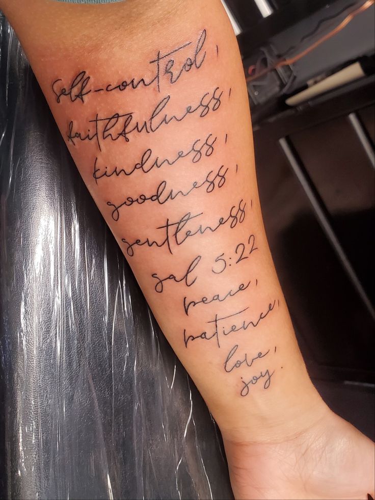 a person with a tattoo on their leg that has writing on it and the words in cursive font