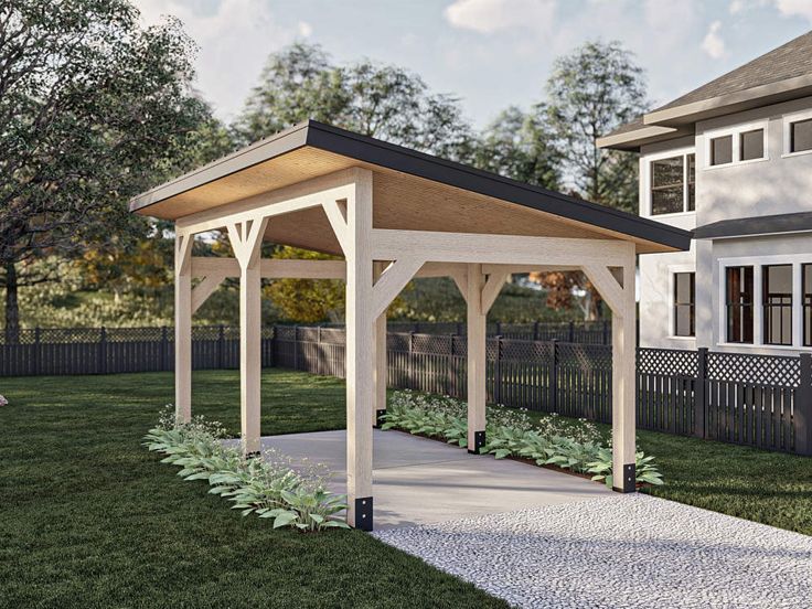 a gazebo sitting on top of a lush green field