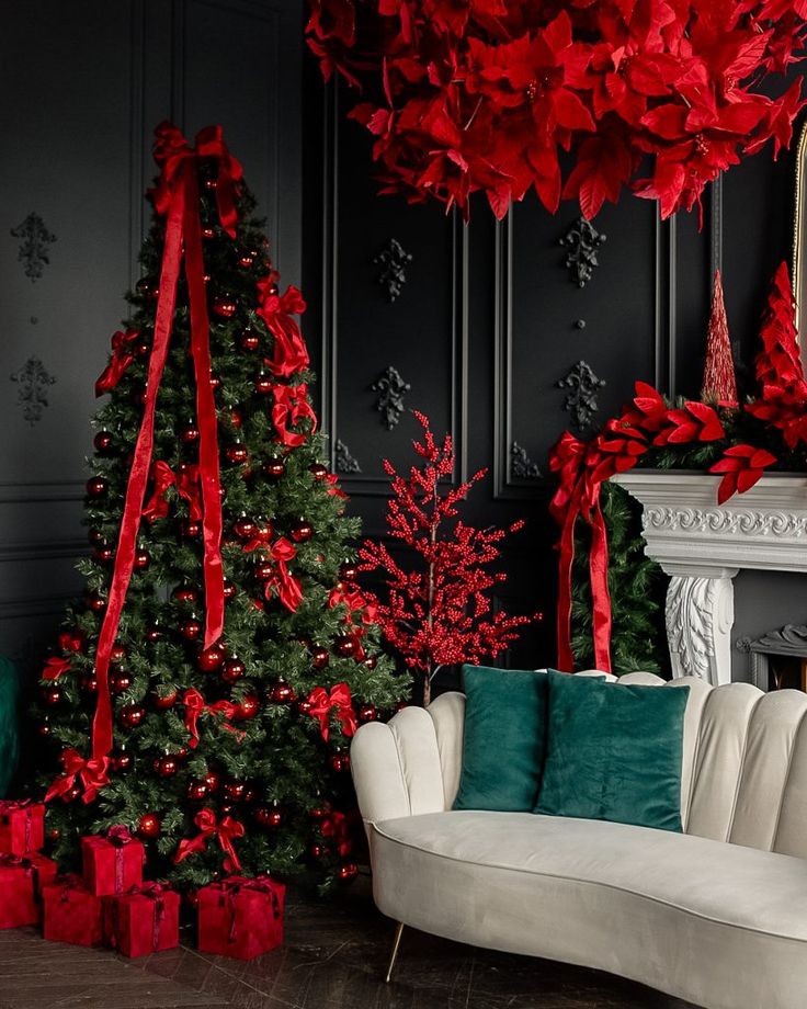 a living room decorated for christmas with red and green decorations