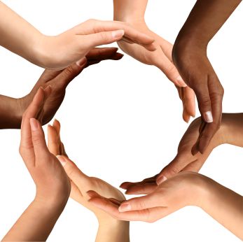 several hands in a circle holding each other