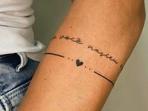 a woman's arm with a tattoo that says, i love you and heart