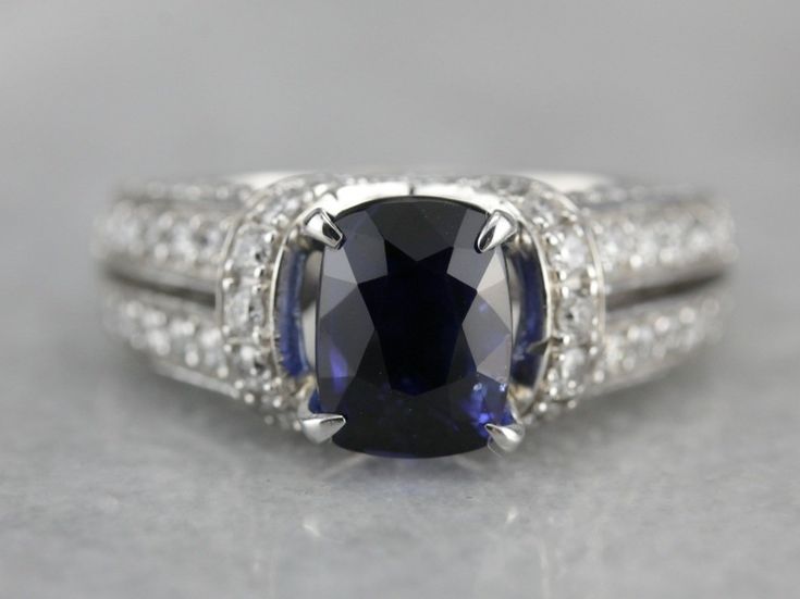 an oval shaped blue sapphire and diamond ring