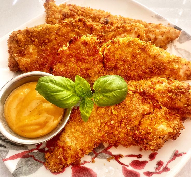 fried chicken with dipping sauce on a plate