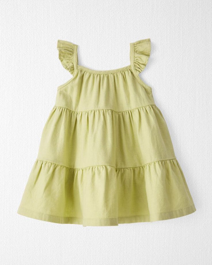 Crafted in soft LENZING™ ECOVERO™ and linen, this easy breezy sundress makes for a timeless summer style. With ruffle straps and an attached diaper cover, this tiny dress brings big charm that's gentle on baby and kind to our little planet. Crafted in the purest organic fabrics and sustainable materials, Little Planet is a return to simplicity. Thoughtful essentials and timeless pieces to gift or to hold on to. Cute Linen Summer Dress, Cute Linen Beach Dress, Cotton Sundress With Tie And Ruffled Straps, Green Sundress With Ruffled Straps For Summer, Cotton Tiered Sundress For Summer, Green Ruffled Straps Sundress For Summer, Tiered Cotton Sundress For Summer, Tiered Cotton Sundress With Adjustable Straps, Ruffled Sundress For Summer