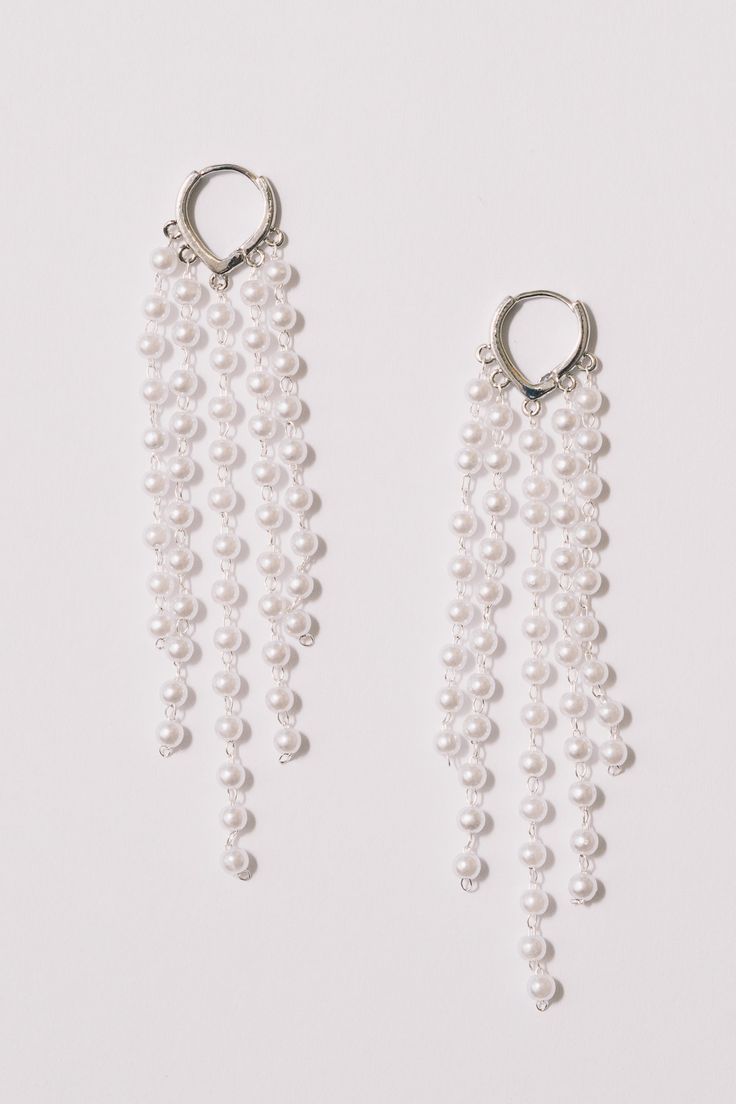 These pearl fringe hoop statement earrings are ready to party. Light and airy, full of movement, they will dance on your ears!Dimensions: Hangs 4" Materials: Simulated pearls, Alloy, 18k Gold Plating. Lever back closure.Ships in a branded jewelry pouch and box, perfect for gift giving! Fringe Hoop Earrings, Pearl Fringe, Pearl Statement Earrings, Prom 2024, Earrings Pearl, Lovely Earrings, Jewelry Pouch, Yellow Color, Gold Plating