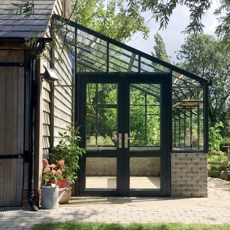 a small house with a large glass door