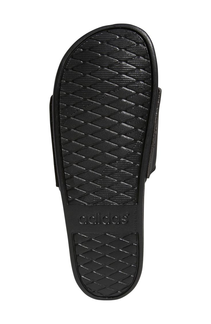 Versatile and comfortable, this bandage-style slide cushioned with a contoured footbed is perfect for laid-back days. Open toe Slip-on style Synthetic upper/textile lining/synthetic sole Imported Slip-resistant Black Sandals, Comfortable Adidas Slides With Synthetic Material, Adidas Synthetic Slip-on Slides, Adidas Slip-resistant Slip-on Slides, Non-slip Synthetic Slides, Adidas Cushioned Slide Flip Flops, Adidas Slide Flip Flops With Cushioned Footbed, Comfortable Adidas Open Toe Slides, Comfortable Open Toe Adidas Slides