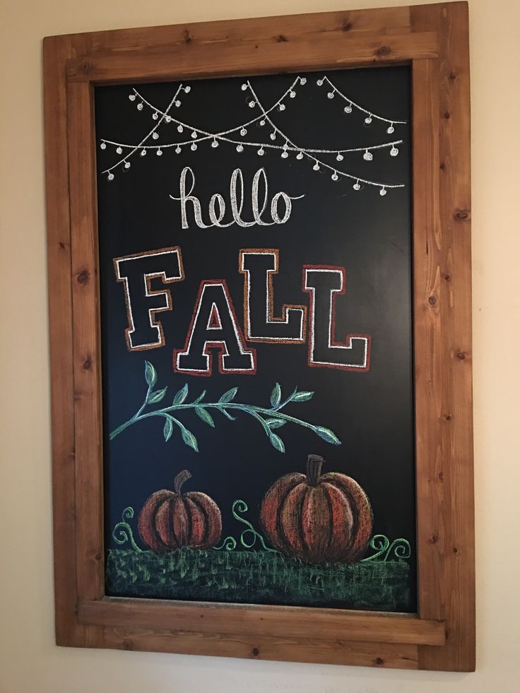 a chalkboard with the words hello fall painted on it