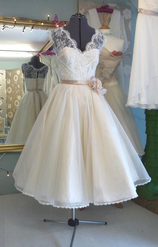 a dress on display in front of a mirror