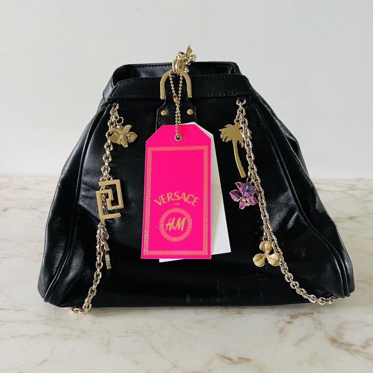 New With Tags. Shows Wear On The Magnet & Defect On Leather Over Time. * Solid, Chain Accents, Metal Accents, Black 10.75" Length, 8.75" Height, 5.25" Depth Pet Free & Smoke Free Environment. Metal Accents, H&m Women, Women Accessories Bags, Metallic Accents, Womens Tote Bags, Gold Chains, Versace, H&m, Shoe Accessories