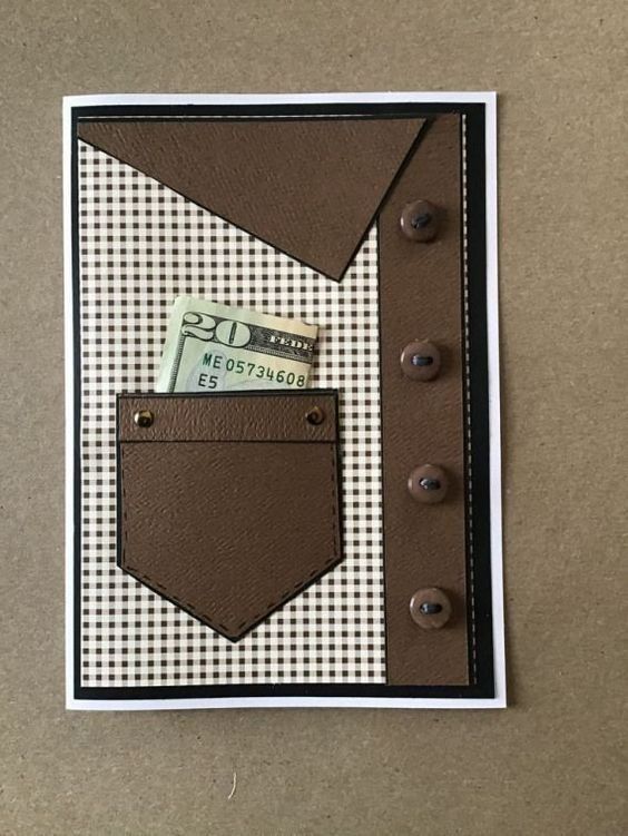 a card with a pocket for money and buttons on it, sitting on a table