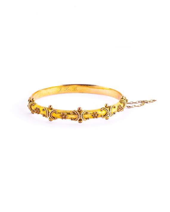 The 9 carat gold is bright and the bangle has so much detail. It holds so much detail with rope twists and orbs. The inside of the bangle has the original owners initials reading 'J.R.B' and is fully hallmarked. Made in Birmingham, England. Inner Diameter: 60mmBangle Width: 11mm Weight: 9g Ceremonial Yellow Gold Jubilee Bracelet, Victorian Gold Bangle Cuff Bracelet, Victorian Gold Hinged Bangle, Gold Victorian Hinged Bangle, Gold Victorian Bangle With Intricate Design, Victorian Gold Bangle Bracelet With Intricate Design, Antique Yellow Gold Hallmarked Bangle, Antique Hallmarked Yellow Gold Bangle, Vintage Yellow Gold Bangle