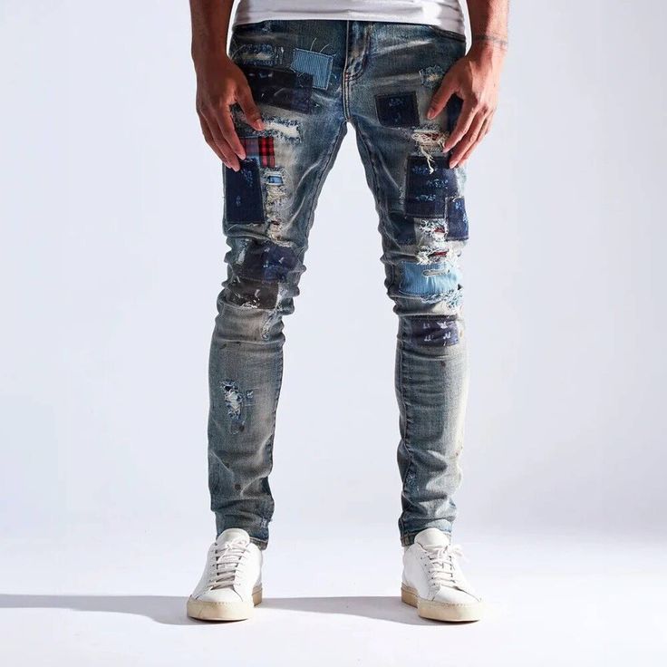 * Embellish Nyc Men's Jean * Distressed Denim * Patchwork And Rip Details * Skinny Fit * Stretch Fabric * 98% Cotton, 2% Spandex * 34" Inseam * Imported * Mpn Embhol21-1-18 * Msrp $45 Ripped Blue Recycled Denim Bottoms, Ripped Blue Cotton Bottoms, Ripped Blue Bottoms In Recycled Denim, Blue Ripped Cotton Bottoms, Fitted Distressed Denim Blue Jeans, Blue Patchwork Jeans For Fall, Fall Blue Patchwork Jeans, Fitted Distressed Denim Pants, Blue Ripped Jeans For Fall