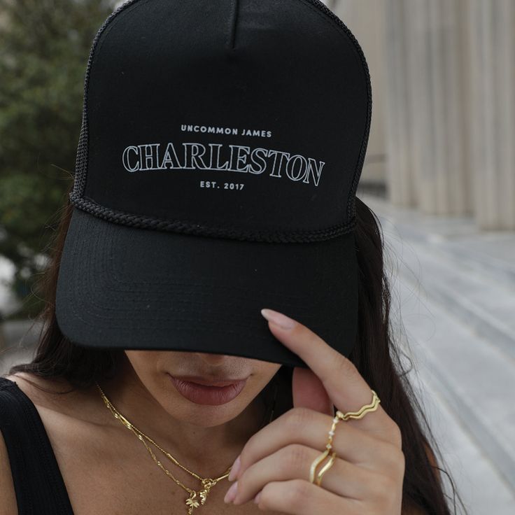 This hat goes out to all of our Charleston lovers! Coming in black and beige, our Charleston Trucker Hat is the perfect accessory for all of those warm, sunny days. For a complete look make sure you get our Charleston Sweatshirt. Want more styles? Shop our full apparel line. Urban Black Hat For Everyday Wear, Urban Black Hat For Everyday, Black Adjustable Snapback Hat For Everyday, Black Snapback Trucker Hat For Everyday, Casual Black Trucker Hat For Everyday, Everyday Black Snapback Trucker Hat, Casual Black Trucker Hat, Everyday Black Hat With Curved Brim, Black Baseball Cap For Summer