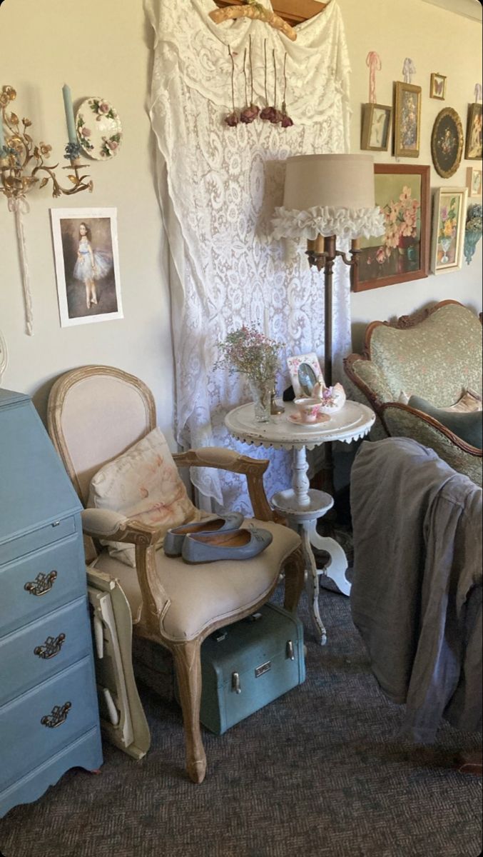 an old fashioned bedroom with antique furniture and pictures on the wall