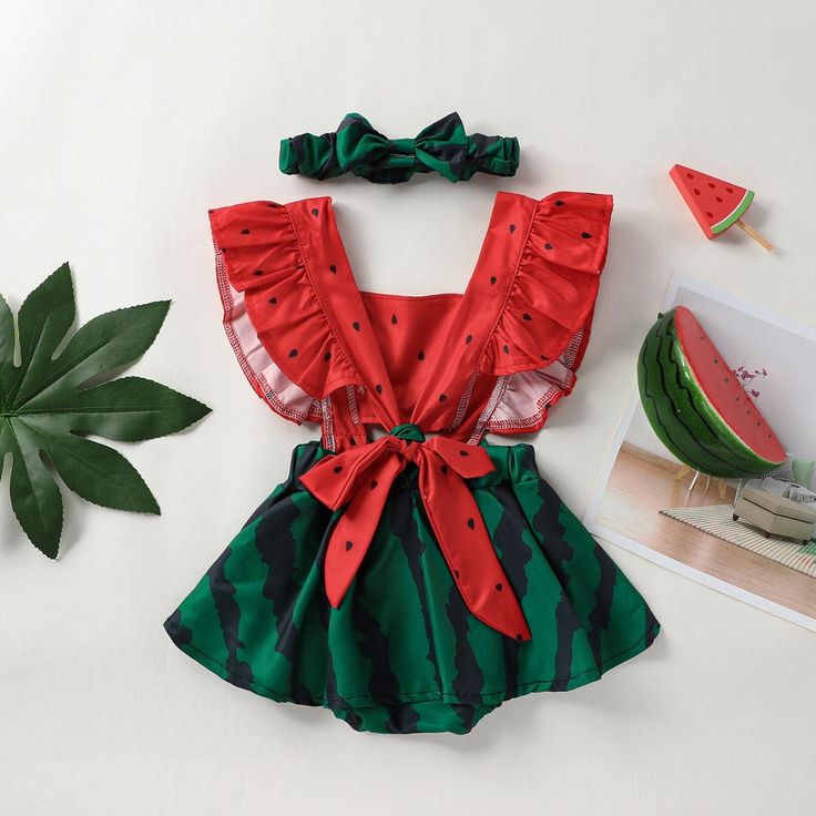 Dress your little one in the refreshing and adorable style of our Watermelon Ruffle Sleeve Baby Jumpsuit. This charming jumpsuit is perfect for the sunny days of spring and summer, adding a delightful touch to your baby's wardrobe. The jumpsuit features a vibrant watermelon print, capturing the essence of summer fun and adding a pop of color to your baby's outfit. The ruffled sleeves add a playful and feminine touch, creating a cute and fashionable look. Designed with convenience in mind, the ju Spring Vacation Bubble Romper With Ruffles, Cute Ruffled Bubble Romper For Vacation, Cute Bubble Romper With Ruffles For Vacation, Summer Cotton Sets With Strawberry Print, Playful Red Summer Sets, Summer Bubble Romper With Ruffles For Beach, Summer Cotton Onesie With Ruffles, Cute Summer Bubble Romper For Vacation, Summer Beach Bubble Romper