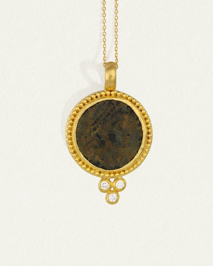 A 24k gold pendant with gold ball detailing and natural diamonds. Shop Antique Coin Necklace with authentic one-of-a-kind coin artefact. Luxury Yellow Gold Coin Medallion Necklace, 22k Gold Coin Pendant Amulet Jewelry, 22k Gold Amulet Jewelry With Coin Pendant, Luxury Gold Plated Coin Necklace, Diamond Coin Pendant Jewelry, Yellow Gold Amulet Coin Necklace, Yellow Gold Coin Pendant Necklace In Amulet Style, Yellow Gold Coin Medallion Necklace With Large Pendant, Yellow Gold Byzantine Medallion Coin Necklace