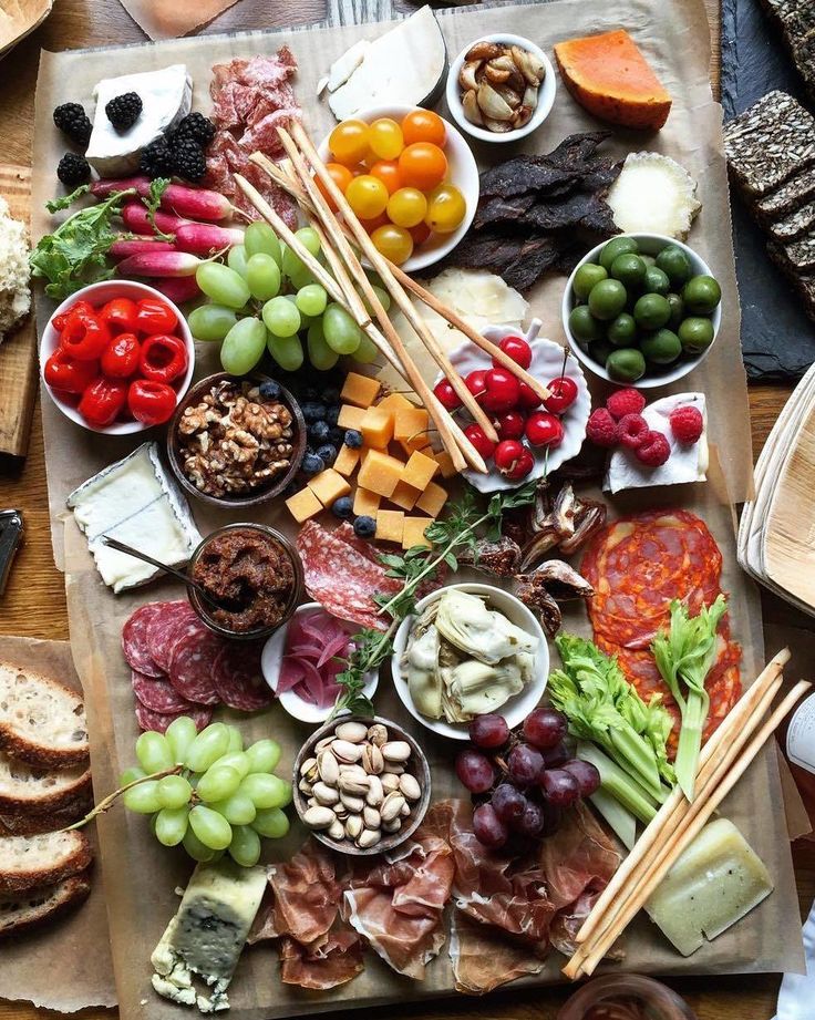 a wooden table topped with lots of food