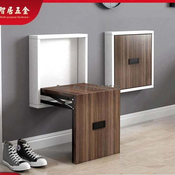 a pair of shoes is sitting on the floor next to a desk and cabinet with two doors