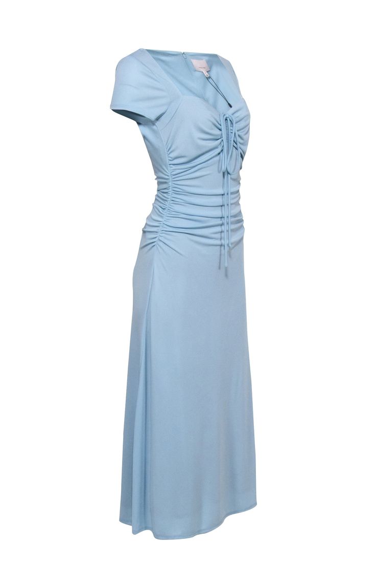 Be the belle of the ball in this Cinq a Sept blue dress! Featuring 'it girl' gear, side ruched details, and a tie front bust, you'll look and feel beautiful in this something blue goddess dress. Style it with strappy heels and you'll be stepping out in style! Size 8 Shell 95% Polyester, 5% Spandex Lining 83% Nylon, 17% Elastane Invisible back zipper Tie front bust Side ruched Short sleeve Bust 36" Waist 22" Shoulder to hem 53" Sleeve length 7.5" Light Blue Fitted Dress With Ruched Bodice, Blue Ruched Fitted Dress, Fitted Light Blue Dress With Ruched Bodice, Spring Prom Dress With Ruched Sides, Summer Prom Dress With Ruched Sides, Blue Dress With Ruched Sides For Party, Blue Party Dress With Ruched Sides, Formal Fitted Maxi Dress With Gathered Waist, Fitted Ruched Light Blue Dress