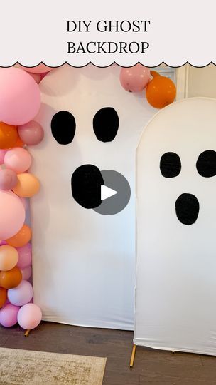 a room with balloons and ghost faces on the wall, in front of a backdrop that says diy ghost back drop