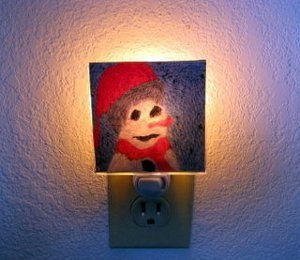 a light that is on the side of a wall with a stuffed animal in it