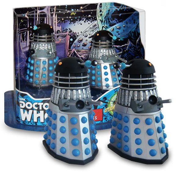 three doctor who toys are in front of a box with the same thing on it