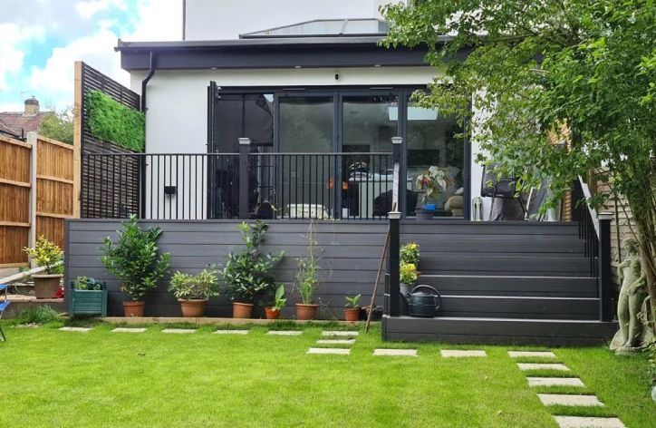 the back yard is clean and ready to be used as an outdoor space for entertaining