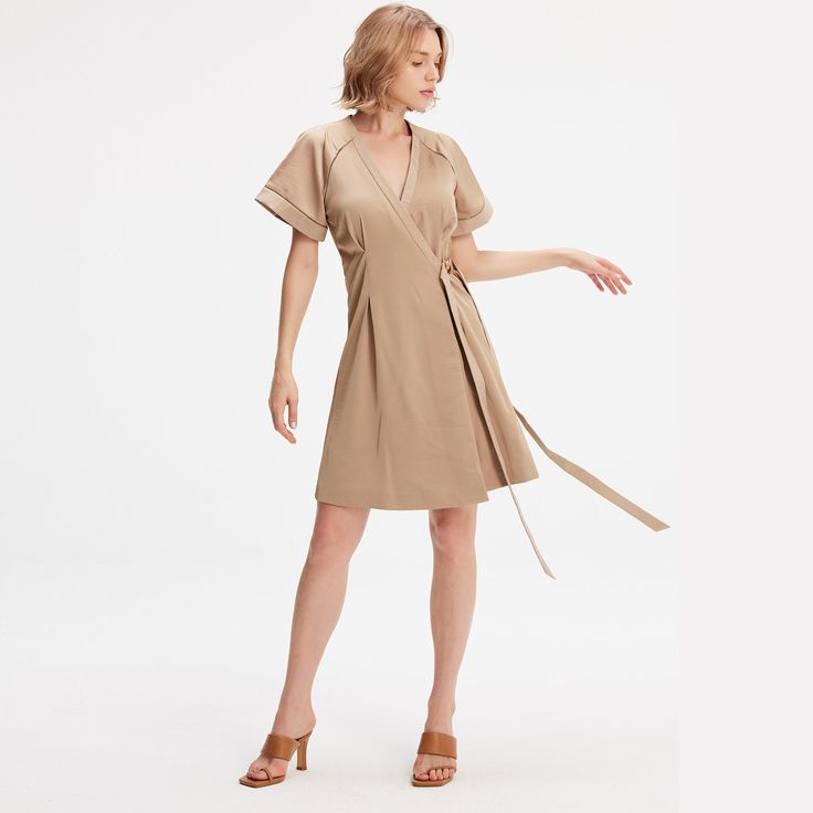 A minimalist and chic cut, this dress elegantly emphasizes any type of silhouette: fitted to the waist not a wallet system, wide raglan cuffs, V neckline and flared volume. Refined finishes with inlaid openwork braid and satin trim at the sleeves and along the neckline. A timeless cut in a soft poplin-type fabric that is easy to iron. This dress adapts to various occasions and will be a chic and safe option for your evenings or for the office. Main fabric:  100% Polyester Finishes: 65% Viscose, Dress Elegantly, Size 10 Models, Versatile Outfits, Independent Designers Fashion, Flare Skirt, Fashion Sense, Coat Dress, Slow Fashion, Badger