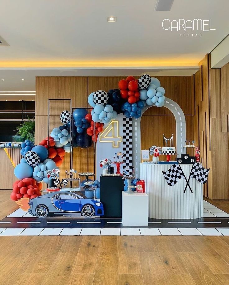 a car themed birthday party with balloons and decorations