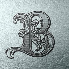 the letter b is made up of swirls and scrolls on a piece of paper