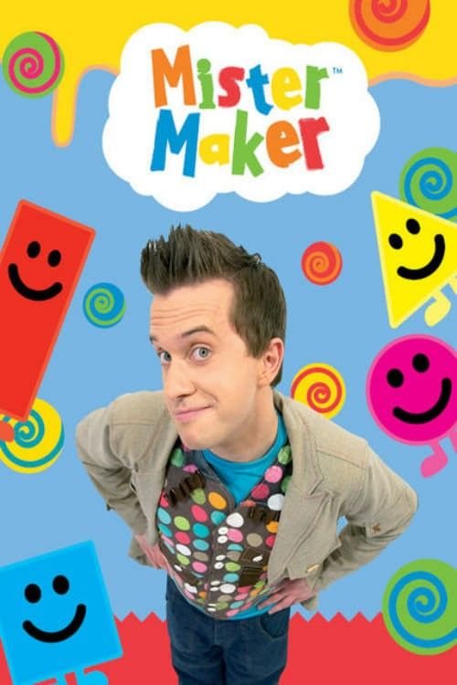 a man with his hands on his hips standing in front of some colorful shapes and smiling