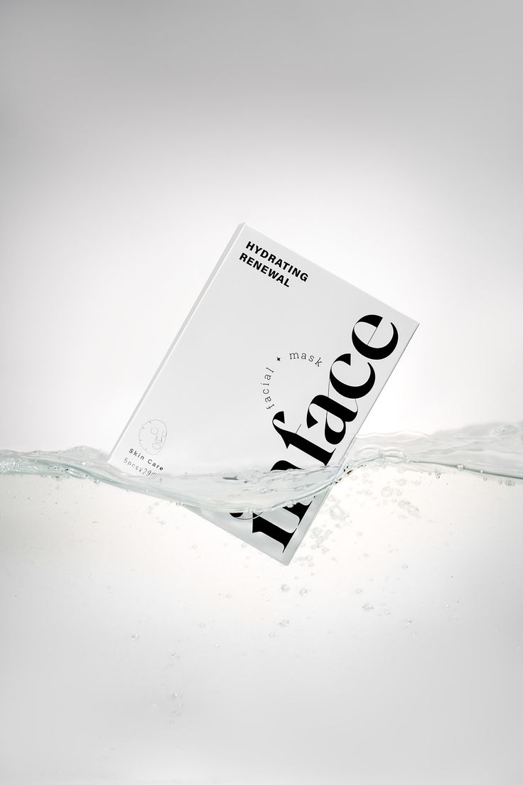 a book floating in the water with it's cover partially submerged