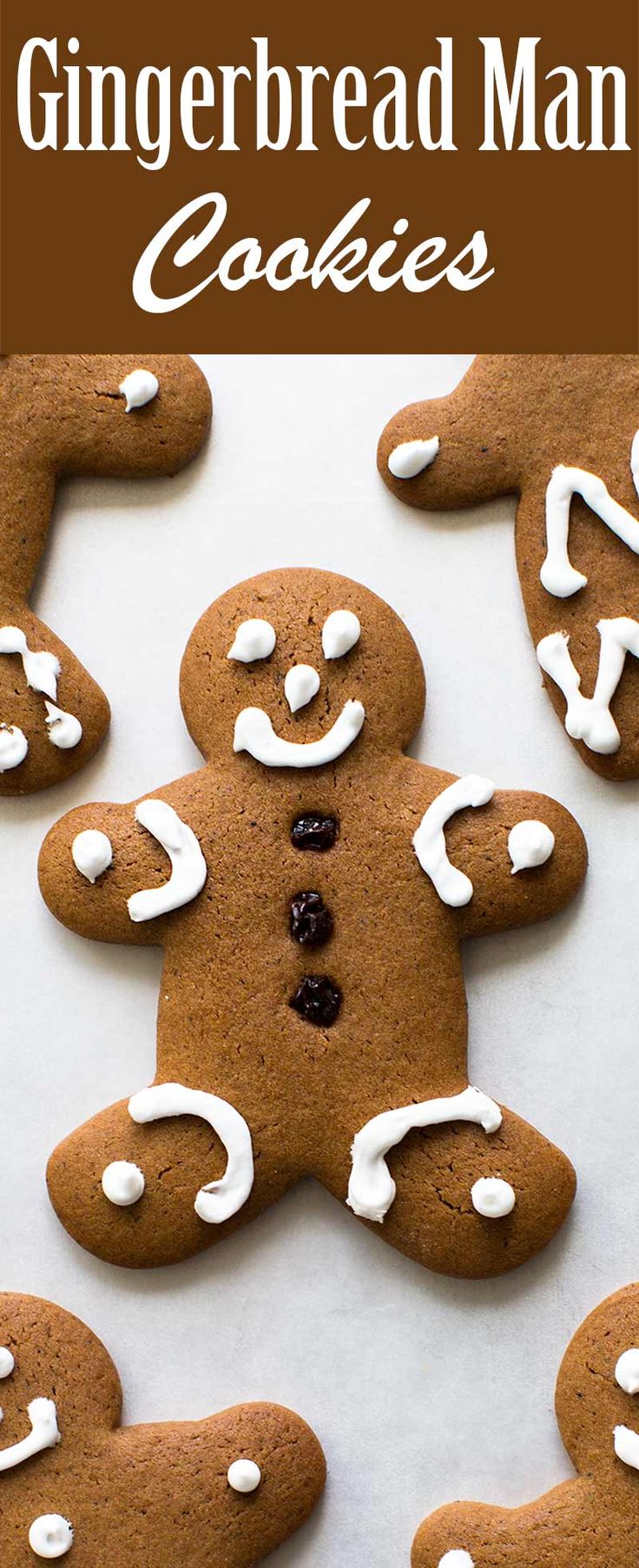 gingerbread man cookies with white icing and chocolate chips