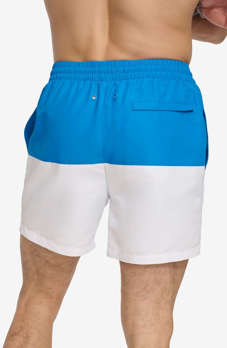 Soak up the sun in these cool colorblocked swim trunks built from quick-drying fabric. 5" inseam (size Medium) Elastic/drawstring waist Front slant pockets; back patch pocket Lined 100% polyester Machine wash, tumble dry Imported White Summer Shorts For Water Sports, White Short Swim Trunks For Water Sports, White Shorts For Water Sports In Summer, White Sporty Swim Trunks For Water Sports, Nylon Beachwear Athletic Shorts For Swimming, Beachwear Nylon Athletic Shorts For Swimming, Nylon Athletic Beachwear Shorts For Swimming, White Swim Trunks For Water Sports, White Swim Trunks With Upf 50+ For Summer