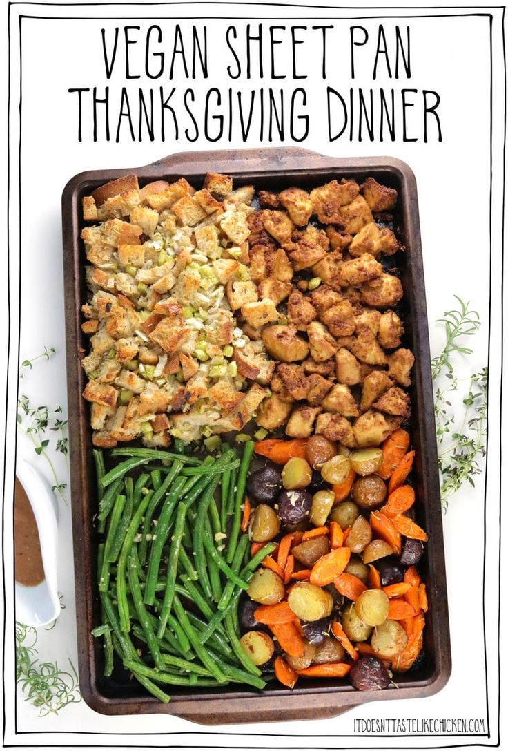 a tray filled with vegetables and stuffing next to a spoon