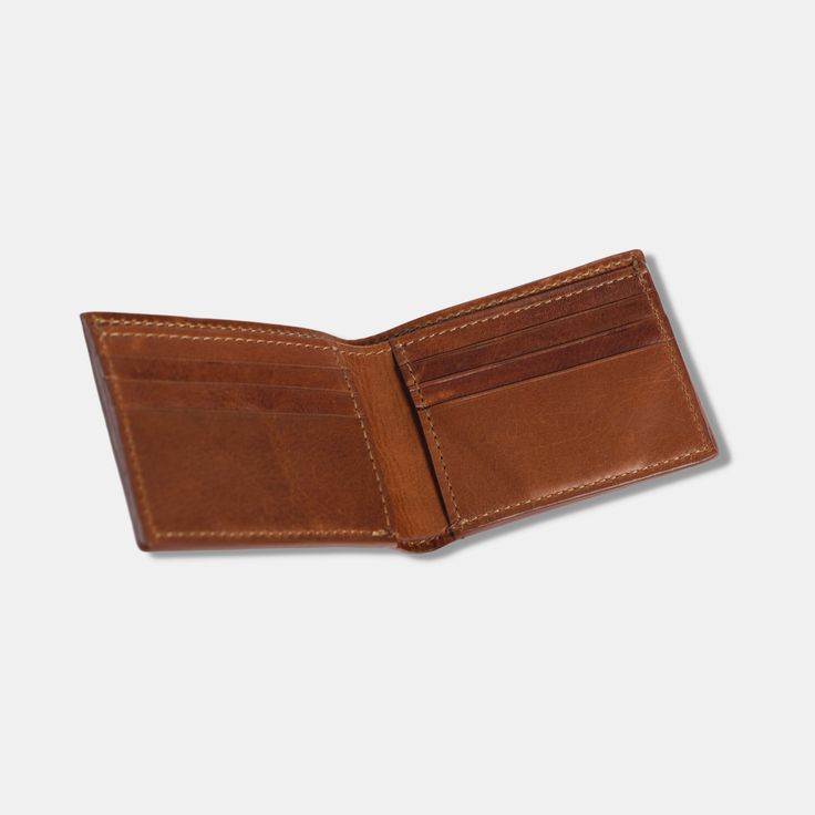 The Gordon Bifold Wallet is the essential billfold to keep your cards and cash secure. Made with our full-grain full-aniline leather, the Gordon Bifold Wallet features six credit card pockets, two interior vertical stash pockets, and one bill compartment to store everything you need. MONOGRAMMING DETAILS: Add a personal touch to your Wallet with monogramming! You can add 3 letters in a blind stamp monogram. Please include the desired initials in the Additional Notes section during check out. Our Bifold Wallets For Daily Use, Cognac Wallet With Rfid Blocking For Everyday, Cognac Rfid Blocking Wallet For Everyday, Cognac Wallets With Rfid Blocking, Leather Bifold Wallet With Rfid Blocking, Everyday Carry Leather Card Holder With Smooth Grain, Classic Trifold Wallets For Everyday Use, Classic Cognac Wallets With Smooth Grain, Classic Cognac Wallet With Smooth Grain