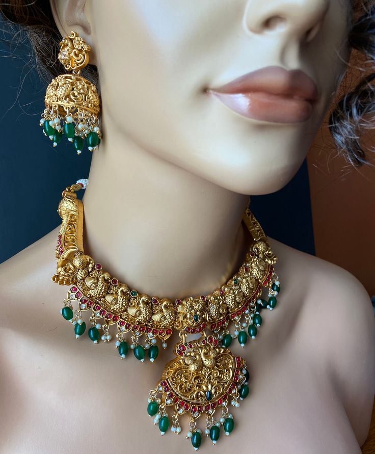 These gorgeous Gold Plated Choker Earrings set are studded with CZ stones and hanging beads added to the charm. Gold Kundan Necklace With Dangling Beads, Festive Gold Kundan Necklace With Dangling Beads, Festive Gold Jewelry With Dangling Beads, Festive Gold Dangle Jewelry Sets, Gold Kundan Chandbali Necklace With Dangling Beads, Gold Chandbali Kundan Necklace With Dangling Beads, Gold Jewelry With Dangling Beads For Festivals, Gold Jewelry With Dangling Beads For Festive Occasions, Gold Chandbali Jeweled Necklaces