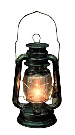 an old fashioned lantern with a light on it's front and side lights in the middle