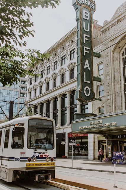 a bus is parked in front of a building with a sign that says buffalo on it