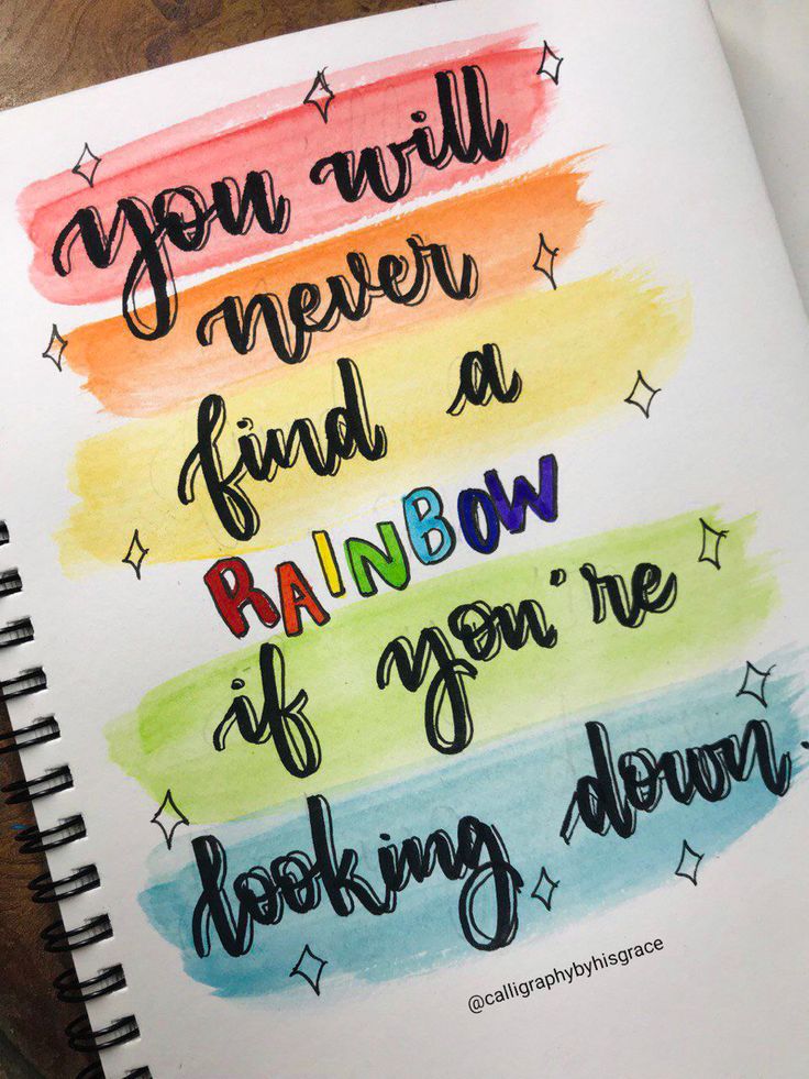 a notebook with the words you will never find a rainbow if you're looking down