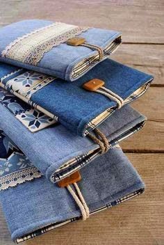 several pairs of jeans stacked on top of each other