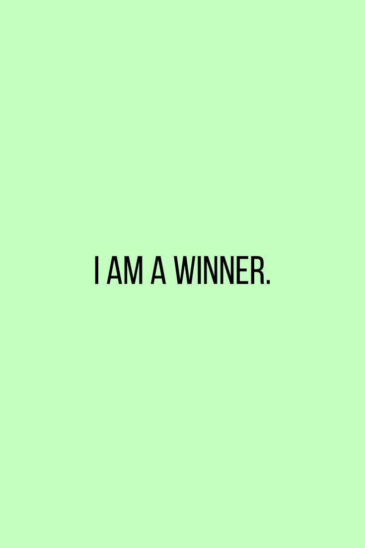 the words i am a winner against a green background